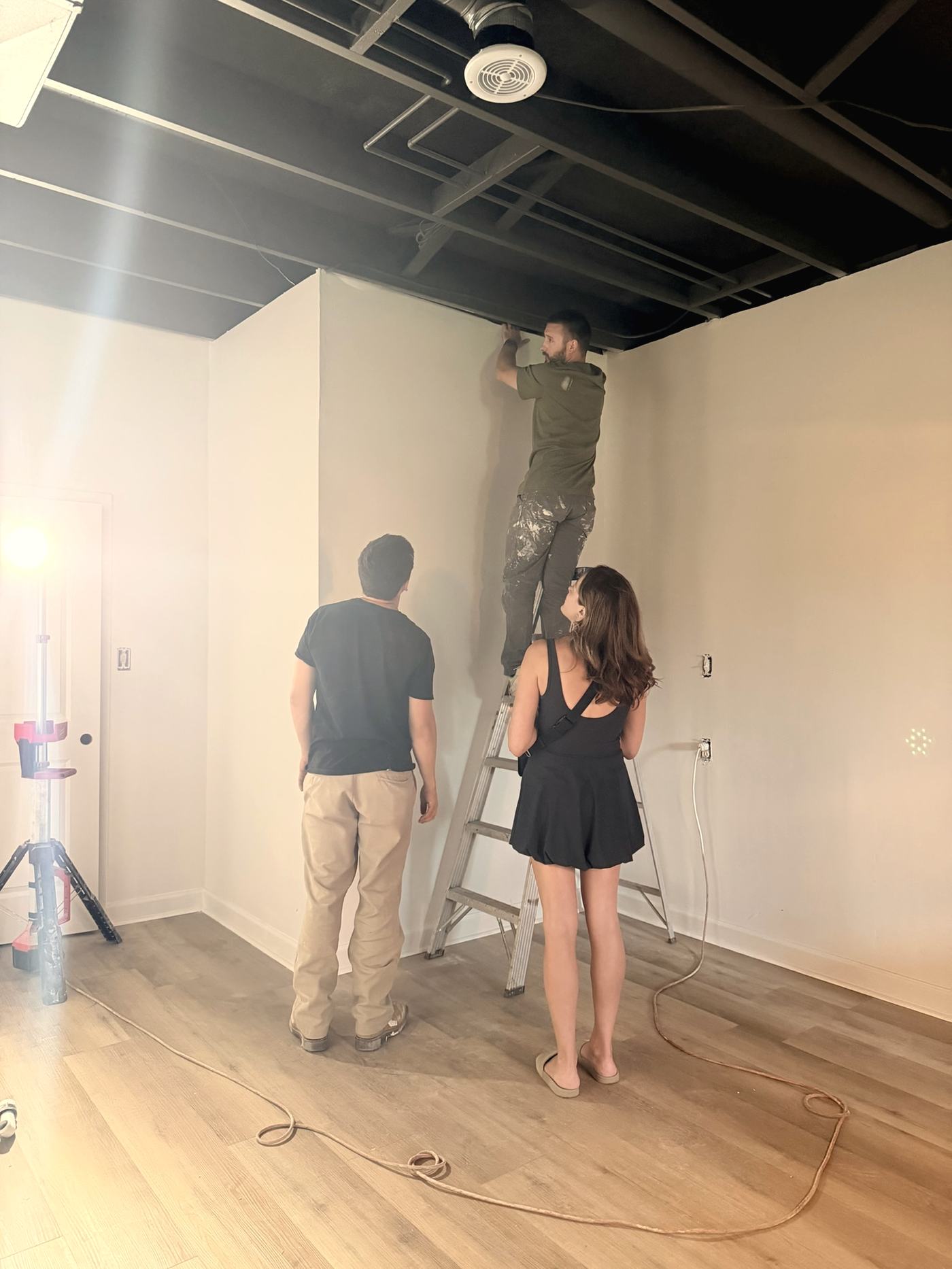 Standing with the crew while work is done overhead