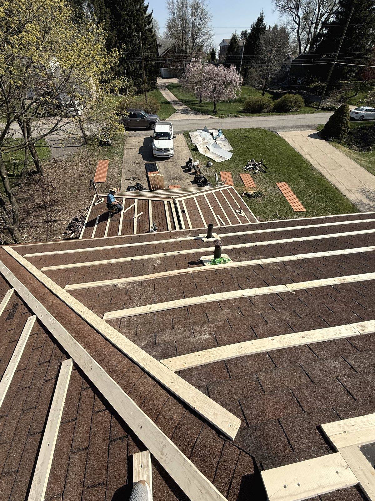 New roof battens laid over an existing deck